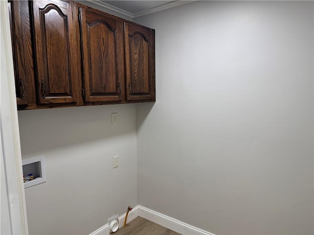 6365 Honey Run Rd, Hornellsville, NY 14843 - washroom with cabinet space, washer hookup, ornamental molding, and wood finished floors