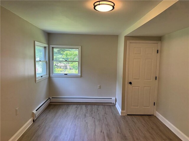 6365 Honey Run Rd, Hornellsville, NY 14843 - spare room with wood finished floors and baseboards