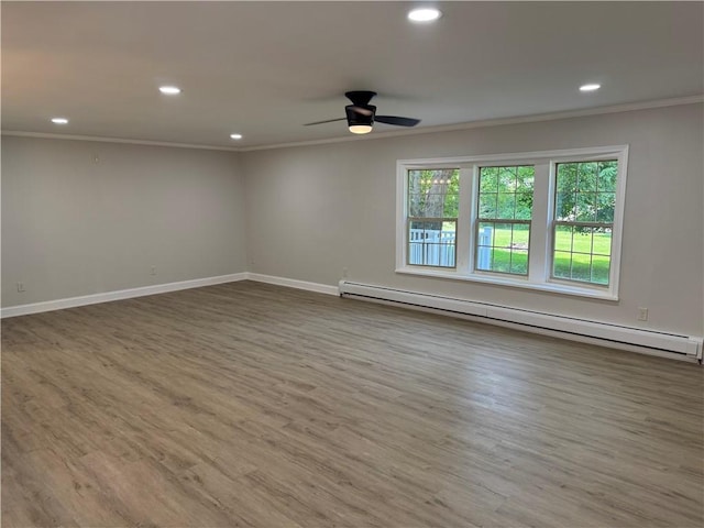 6365 Honey Run Rd, Hornellsville, NY 14843 - unfurnished room with a baseboard radiator, crown molding, ceiling fan, wood finished floors, and recessed lighting