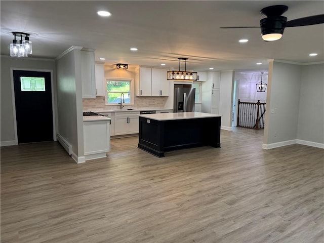 6365 Honey Run Rd, Hornellsville, NY 14843 - kitchen with stainless steel refrigerator with ice dispenser, baseboard heating, light countertops, light wood finished floors, and white cabinets