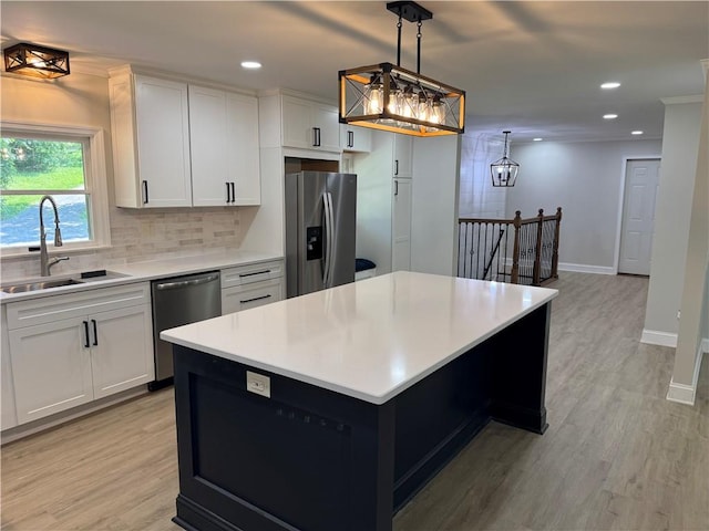 6365 Honey Run Rd, Hornellsville, NY 14843 - kitchen featuring appliances with stainless steel finishes, tasteful backsplash, light countertops, recessed lighting, and light wood-style floors