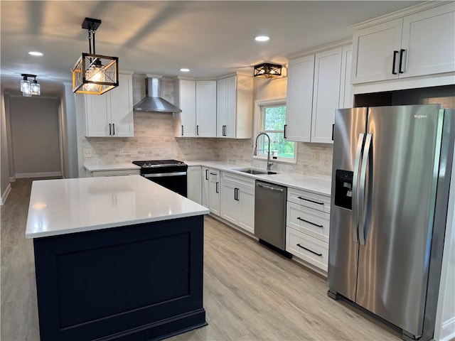 6365 Honey Run Rd, Hornellsville, NY 14843 - kitchen with stainless steel appliances, wall chimney exhaust hood, light countertops, tasteful backsplash, and decorative light fixtures
