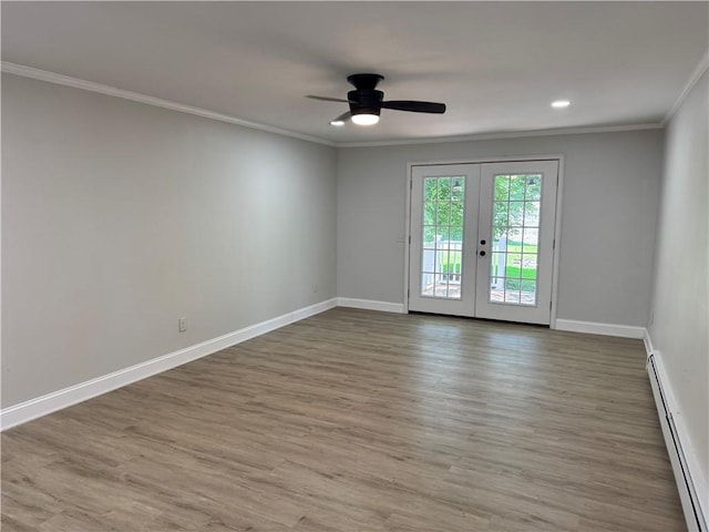 6365 Honey Run Rd, Hornellsville, NY 14843 - unfurnished room featuring baseboard heating, crown molding, ceiling fan, wood finished floors, and french doors