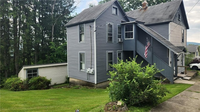 401 Lower Pace Rd, Corning City, NY 14830 - view of front facade featuring a front lawn, a shingled roof, a chimney, and cooling unit