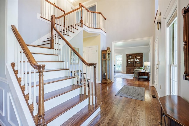 117 Neuchatel Ln, Perinton, NY 14450 - entryway featuring a high ceiling, wood finished floors, and stairs