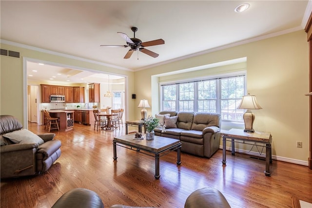 117 Neuchatel Ln, Perinton, NY 14450 - living room with a ceiling fan, wood finished floors, crown molding, and recessed lighting