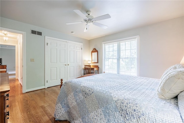 117 Neuchatel Ln, Perinton, NY 14450 - bedroom with wood finished floors, a closet, and a ceiling fan
