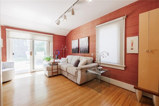 125 Sunset Dr, Brighton, NY 14618 - living room featuring track lighting, light wood-type flooring, and lofted ceiling