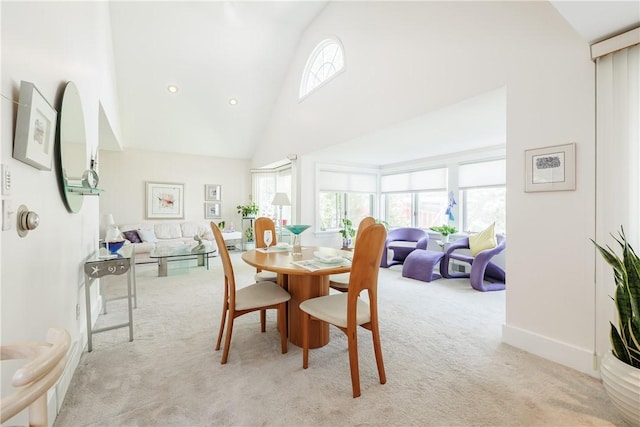 125 Sunset Dr, Brighton, NY 14618 - dining space with high vaulted ceiling and carpet flooring