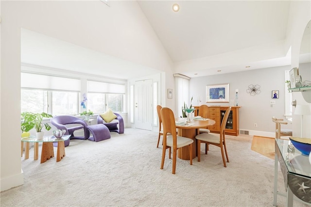 125 Sunset Dr, Brighton, NY 14618 - dining area featuring light carpet, recessed lighting, and high vaulted ceiling