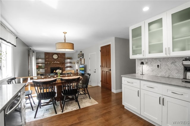 160 Greengage Cir, Amherst, NY 14051 - dining area with dark wood finished floors, a fireplace, and recessed lighting