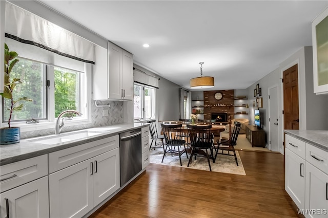 160 Greengage Cir, Amherst, NY 14051 - kitchen with stainless steel dishwasher, backsplash, wood finished floors, and recessed lighting