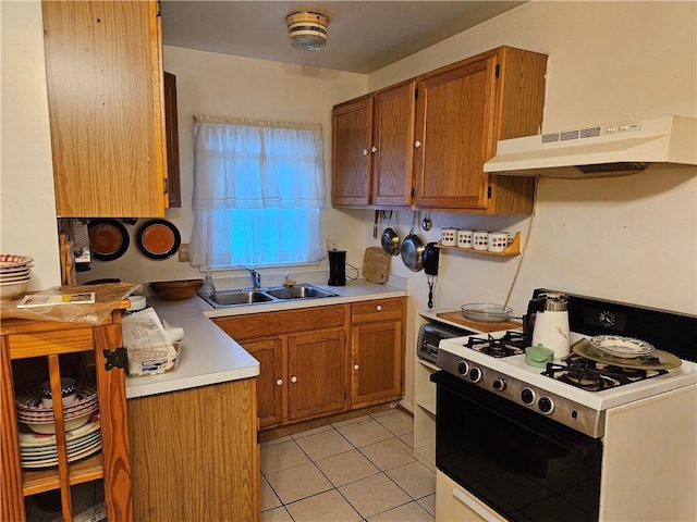 178 Campbell Park, Rochester, NY 14606 - kitchen featuring white gas stove, brown cabinetry, under cabinet range hood, and light countertops