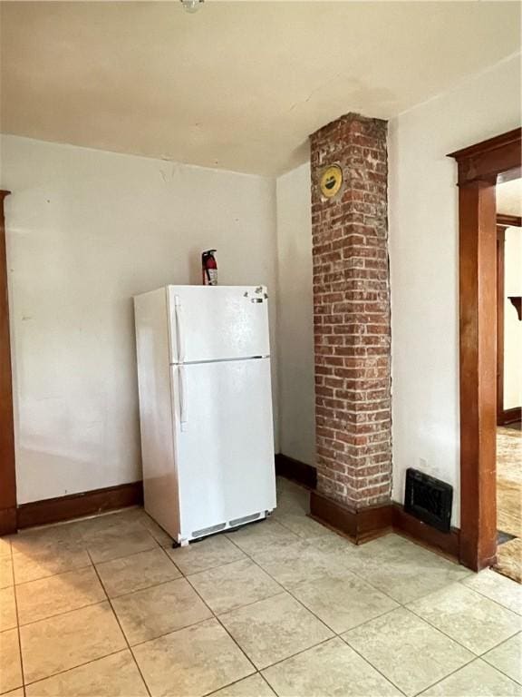 4 Third St, Oneonta, NY 13820 - kitchen featuring freestanding refrigerator and light tile patterned flooring