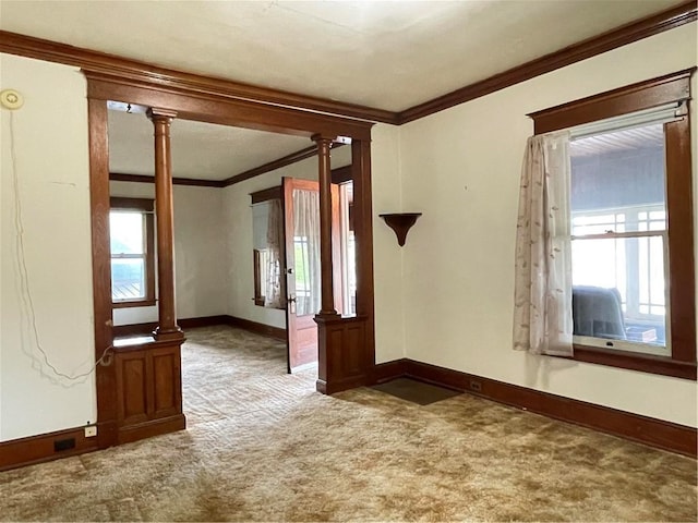 4 Third St, Oneonta, NY 13820 - spare room with carpet, crown molding, healthy amount of natural light, and ornate columns