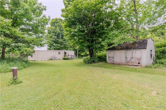218 Campbell Rd, Gouverneur, NY 13642 - view of grassy yard featuring a storage shed