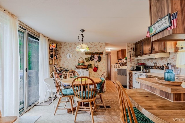 218 Campbell Rd, Gouverneur, NY 13642 - dining room featuring wallpapered walls and washer / clothes dryer