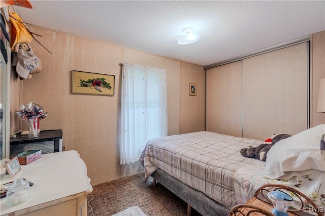 218 Campbell Rd, Gouverneur, NY 13642 - carpeted bedroom featuring a closet and a textured ceiling