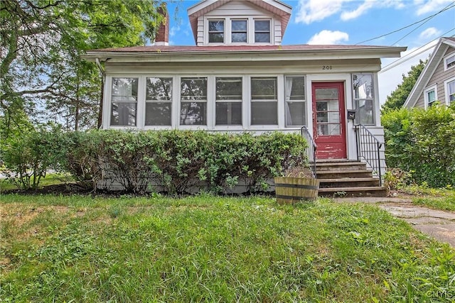 201 Mosley Dr, Syracuse, NY 13206 - view of front of home featuring entry steps, a sunroom, and a front yard