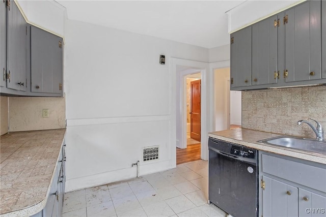 201 Mosley Dr, Syracuse, NY 13206 - kitchen with dishwasher, gray cabinetry, tasteful backsplash, and light countertops