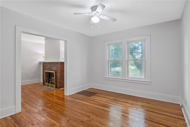 201 Mosley Dr, Syracuse, NY 13206 - unfurnished living room featuring hardwood / wood-style flooring, a fireplace, and ceiling fan