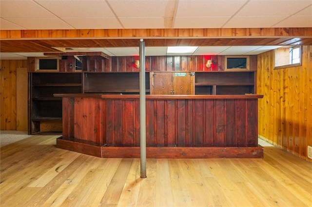 179 Down St, Henrietta, NY 14623 - indoor dry bar featuring wood walls, a paneled ceiling, and wood finished floors
