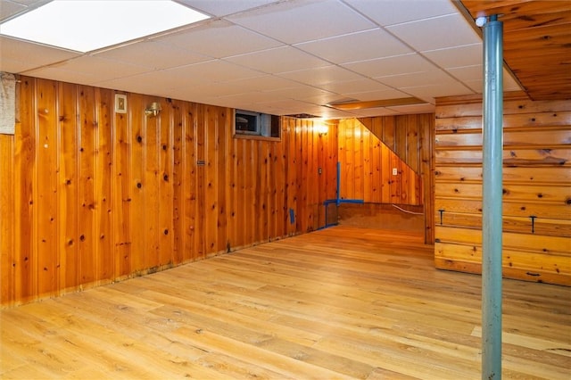 179 Down St, Henrietta, NY 14623 - finished below grade area featuring a drop ceiling, wood finished floors, wood walls, and stairway