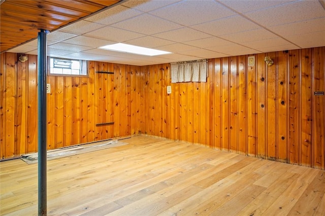179 Down St, Henrietta, NY 14623 - below grade area featuring hardwood / wood-style flooring, a drop ceiling, and wood walls