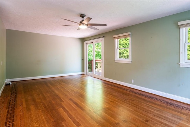 179 Down St, Henrietta, NY 14623 - unfurnished room with wood finished floors, ceiling fan, and a textured ceiling