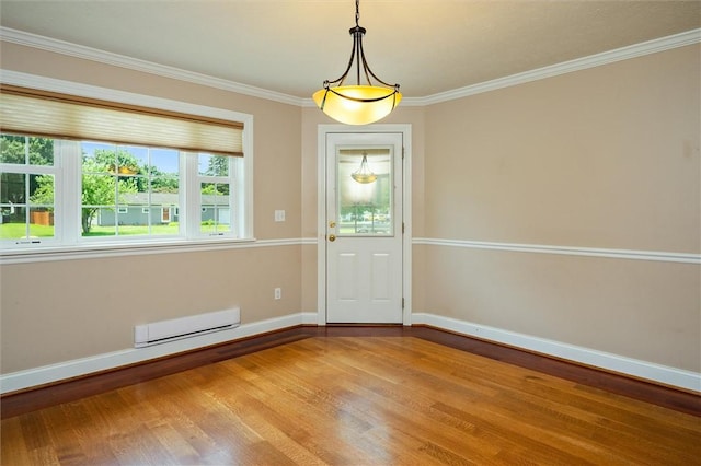 179 Down St, Henrietta, NY 14623 - unfurnished dining area featuring baseboard heating, wood finished floors, and crown molding