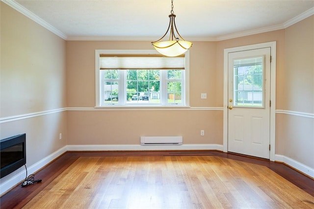 179 Down St, Henrietta, NY 14623 - unfurnished dining area featuring wood finished floors, ornamental molding, and a glass covered fireplace