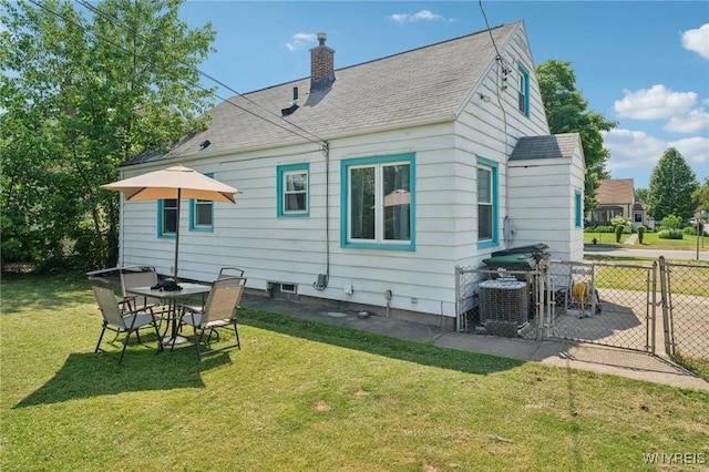 167 Somerville Ave, Tonawanda, NY 14150 - rear view of property with a gate, a chimney, and roof with shingles