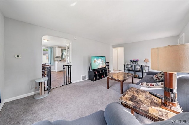 167 Somerville Ave, Tonawanda, NY 14150 - carpeted living area with arched walkways and baseboards