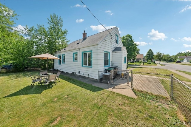 167 Somerville Ave, Tonawanda, NY 14150 - rear view of property featuring a chimney and a gate