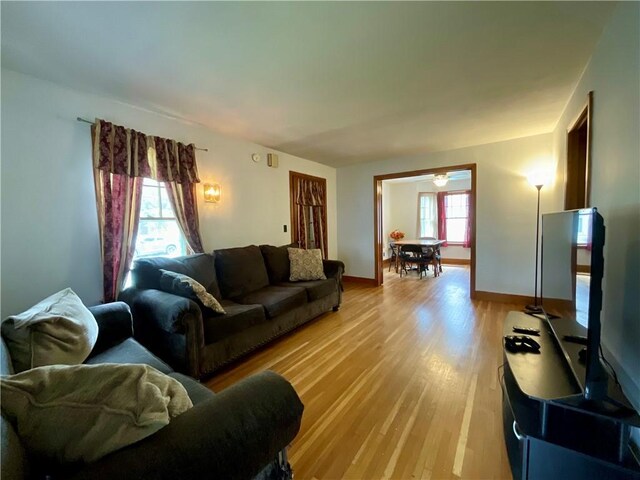 2 Washington St, North Dansville, NY 14437 - living area with light wood-style floors and baseboards