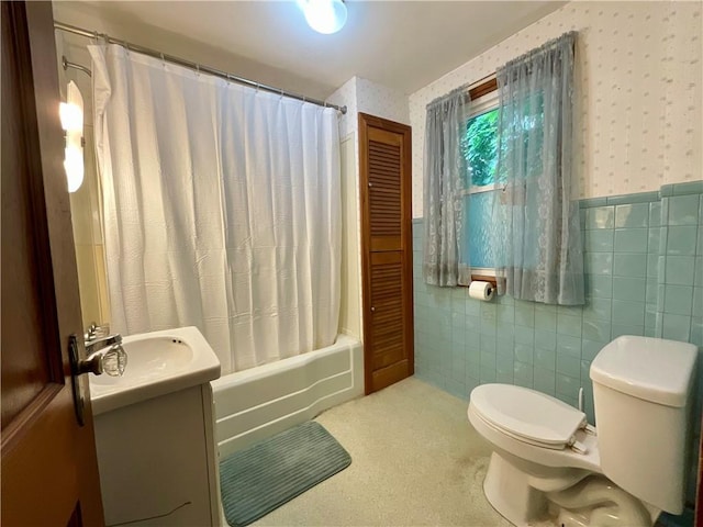 2 Washington St, North Dansville, NY 14437 - full bath with vanity, tile walls, shower / tub combo with curtain, wallpapered walls, and wainscoting
