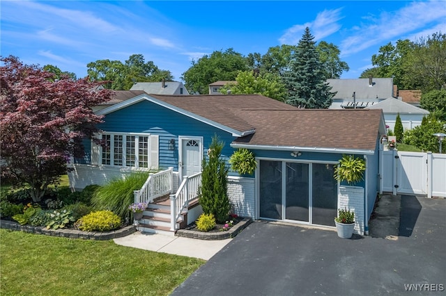1416 99th St, Niagara Falls, NY 14304 - view of front of property featuring a gate, a shingled roof, and brick siding