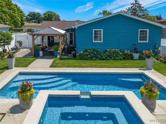 1416 99th St, Niagara Falls, NY 14304 - rear view of property featuring a gazebo, a patio area, an outdoor living space, and a pool with connected hot tub