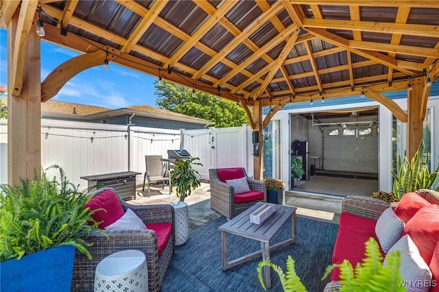 1416 99th St, Niagara Falls, NY 14304 - fenced backyard featuring outdoor lounge area, a gazebo, a gate, a patio area, and grilling area