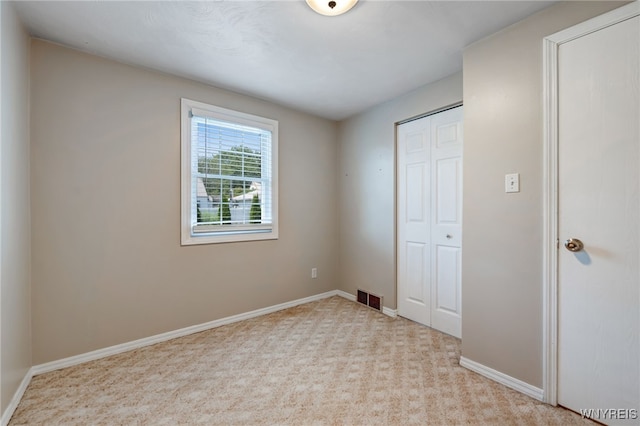 1416 99th St, Niagara Falls, NY 14304 - unfurnished bedroom with a closet and carpet flooring