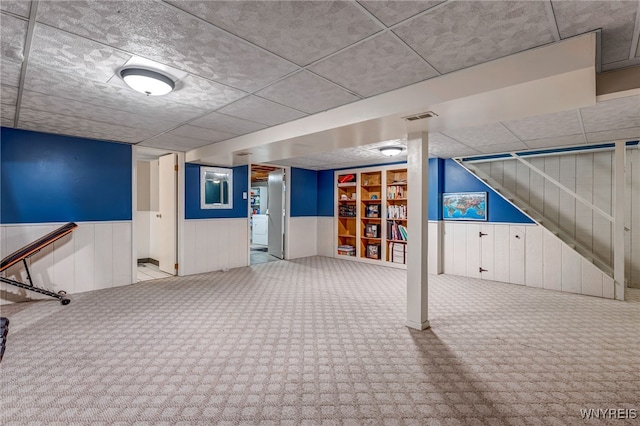 1416 99th St, Niagara Falls, NY 14304 - finished below grade area with carpet, a wainscoted wall, and stairway
