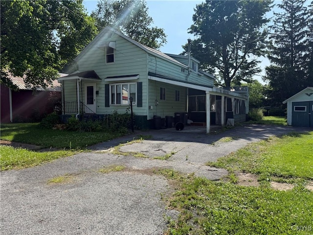 211 W Park St, Lenox, NY 13032 - view of front of home featuring asphalt driveway and a shed