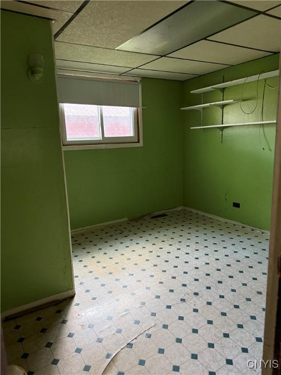 211 W Park St, Lenox, NY 13032 - basement featuring a paneled ceiling and baseboards
