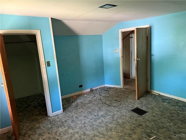 211 W Park St, Lenox, NY 13032 - unfurnished bedroom with vaulted ceiling, carpet, and a closet