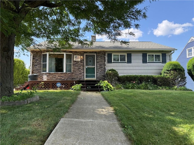 890 Holdridge St, Southport, NY 14904 - single story home featuring a front lawn, a chimney, and stone siding