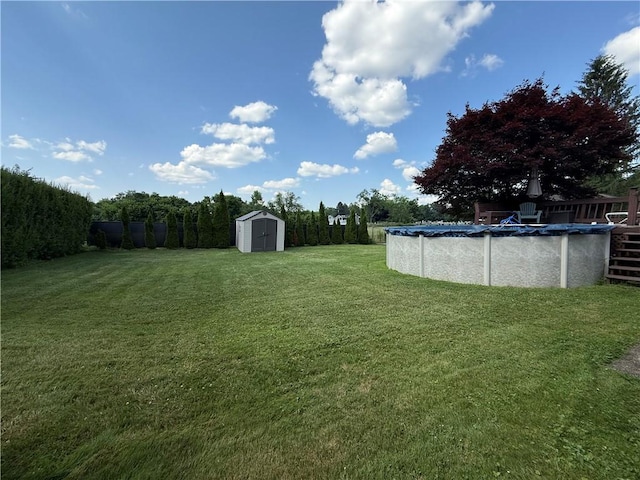 890 Holdridge St, Southport, NY 14904 - view of grassy yard with a storage shed and a covered pool