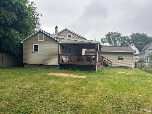 38 Hines St, Buffalo, NY 14220 - back of property featuring a fenced backyard, a deck, and a chimney