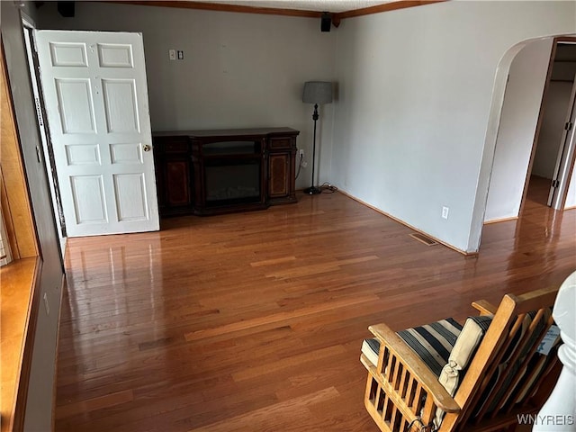 38 Hines St, Buffalo, NY 14220 - living area featuring arched walkways, wood finished floors, and ornamental molding