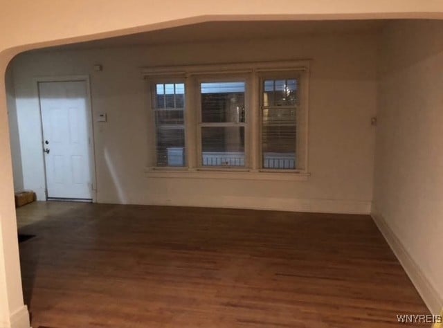83 Custer St, Buffalo, NY 14214 - unfurnished room featuring wood finished floors and arched walkways