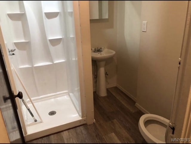 83 Custer St, Buffalo, NY 14214 - bathroom featuring wood finished floors and a stall shower